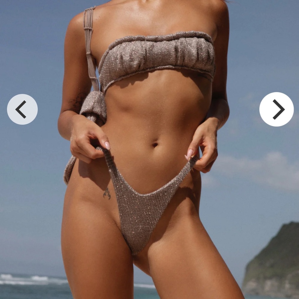Thaikai archangel top    Never worn brand new !
